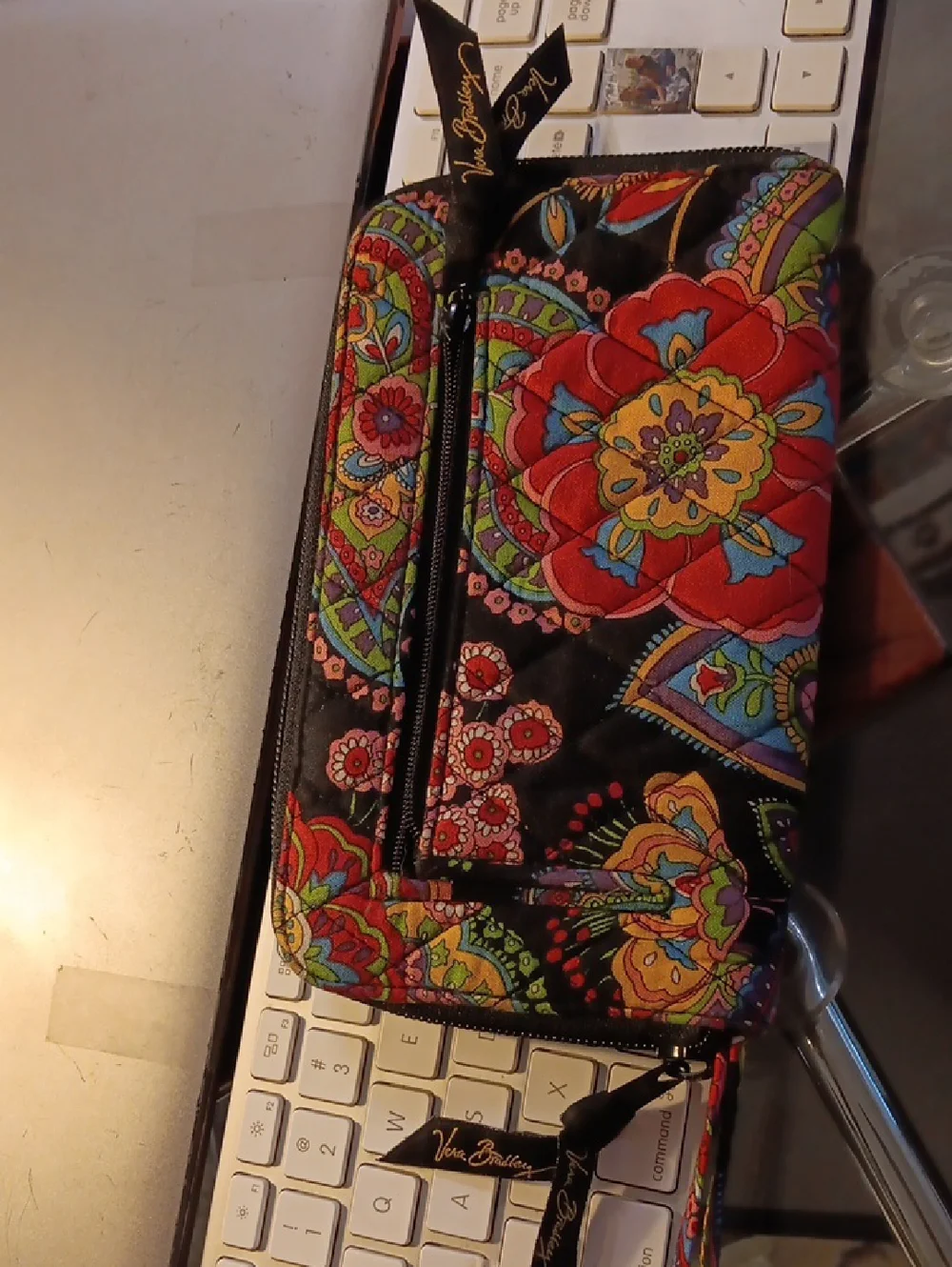Vera Bradley zip-around wallet featuring the "Symphony in Hue" quilted Pattern - Picture 1 of 8